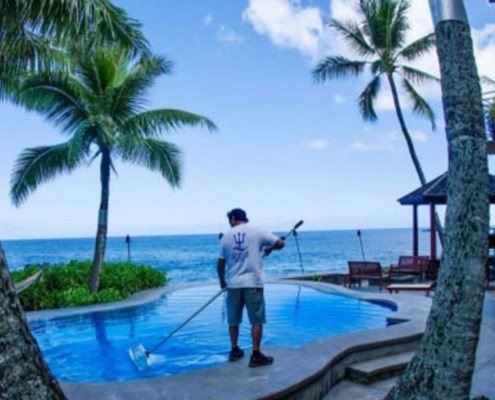 Oahu pool cleaning maintaining a resort pool, Hawaii.