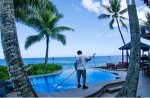 Pool cleaner providing Hawaii resort pool maintenance
