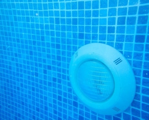 Underwater pool light installation, Oahu.