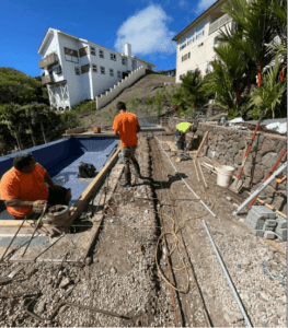 Oahu pool builders lay pipe and conduit for electrical and control wiring.