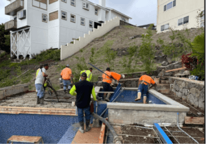 Honolulu pool builders float and pour concrete while adding a pool deck.