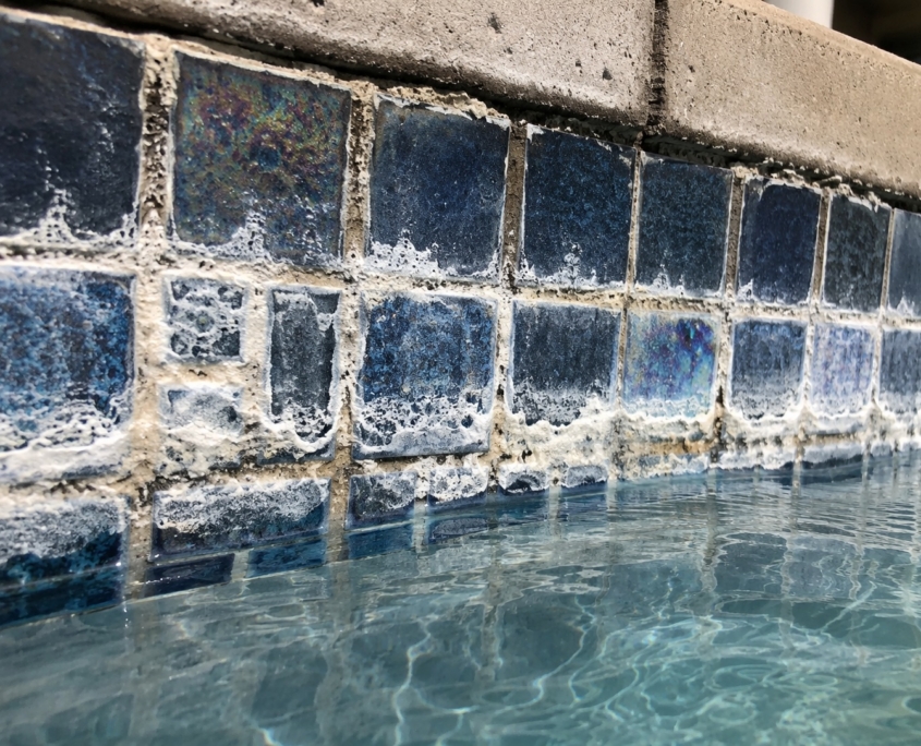 Calcium build up on a pool waterline